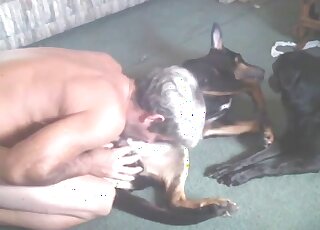 Blondie with short hair enjoying passionate oral with a black dog