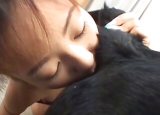 Young Japanese babe is tasting dog's butt for the very first time