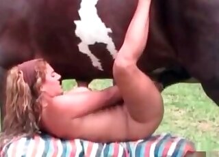 Big horse cums all over the naked body of a zoophile whore