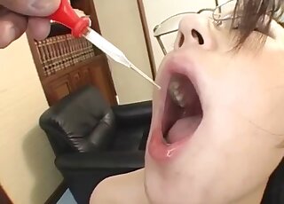 Japanese with nerdy glasses fucks with thed dog and drinks it sperm