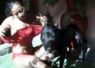 Nasty Latina brunette is trying to seduce her dog for sex