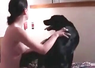 Aroused to the max black dog gladly fucks slender zoophile chick