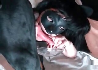 Fishnets-wearing beauty eats dog cum out of a bowl after cumshot
