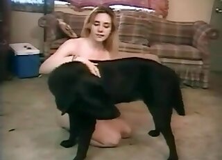 Blonde lady goes filthy with a black dog in a zoophilia scene